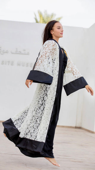 women wearing a modern designer abaya kimono with luxury elements from #Mary and Mary#