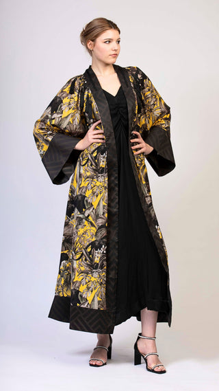 women wearing a modern designer abaya kimono with luxury elements from #Mary and Mary#