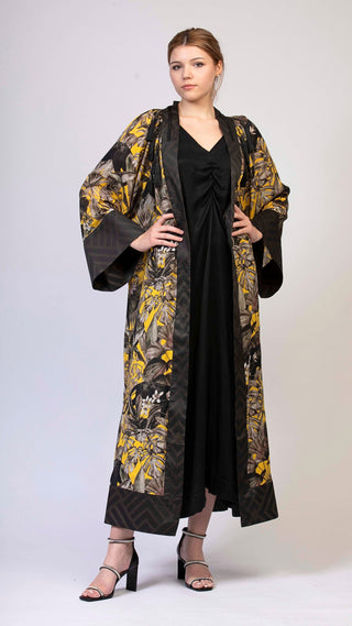 women wearing a modern designer abaya kimono with luxury elements from #Mary and Mary#