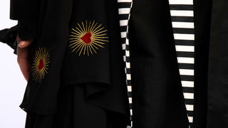 women wearing a modern designer abaya kimono with luxury elements from #Mary and Mary#